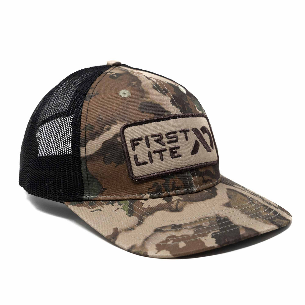 Camouflage trucker hat with black mesh back and a tan "FIRST LITE" logo patch on the front.