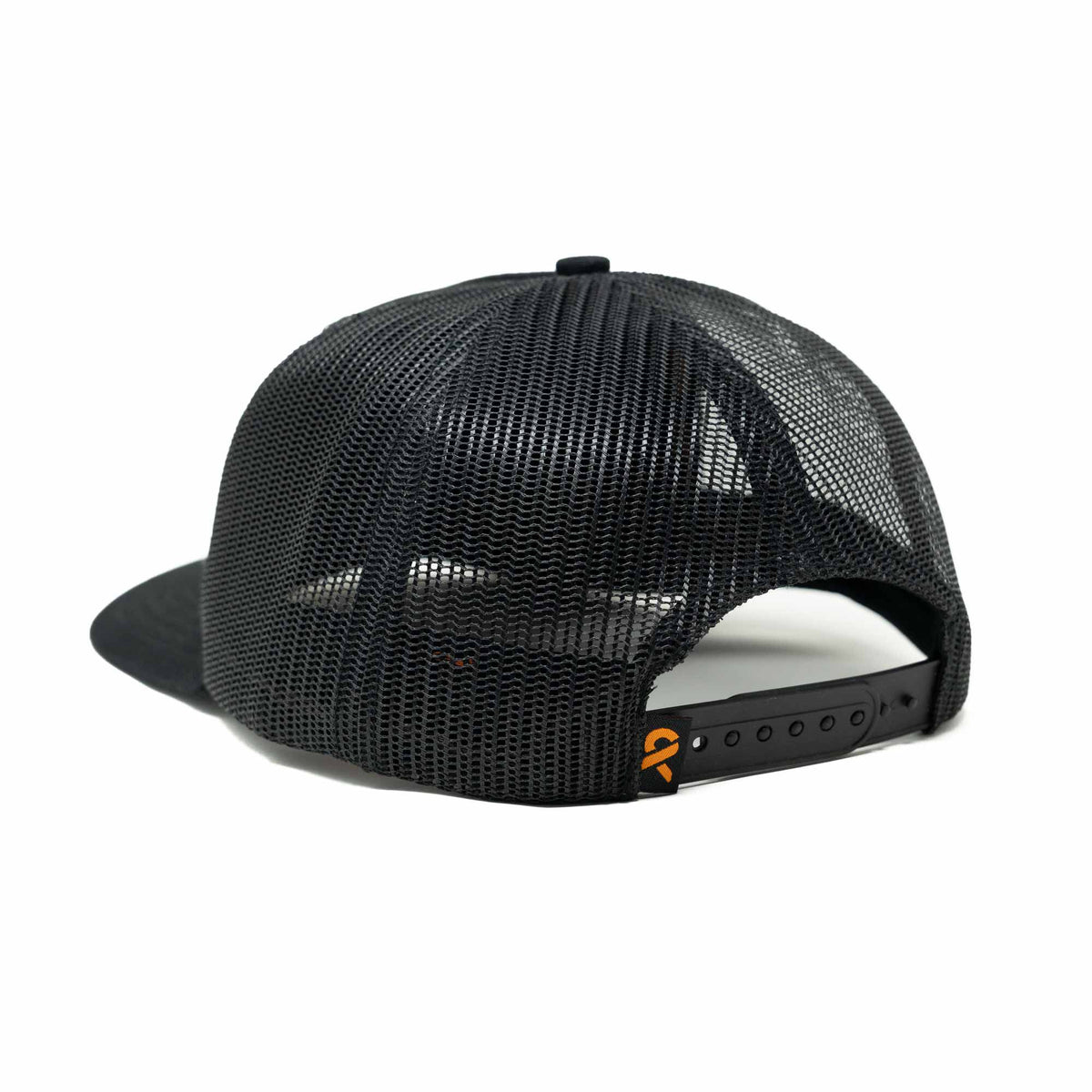 Black trucker cap with a mesh back, snapback closure, and a small orange logo on the strap.