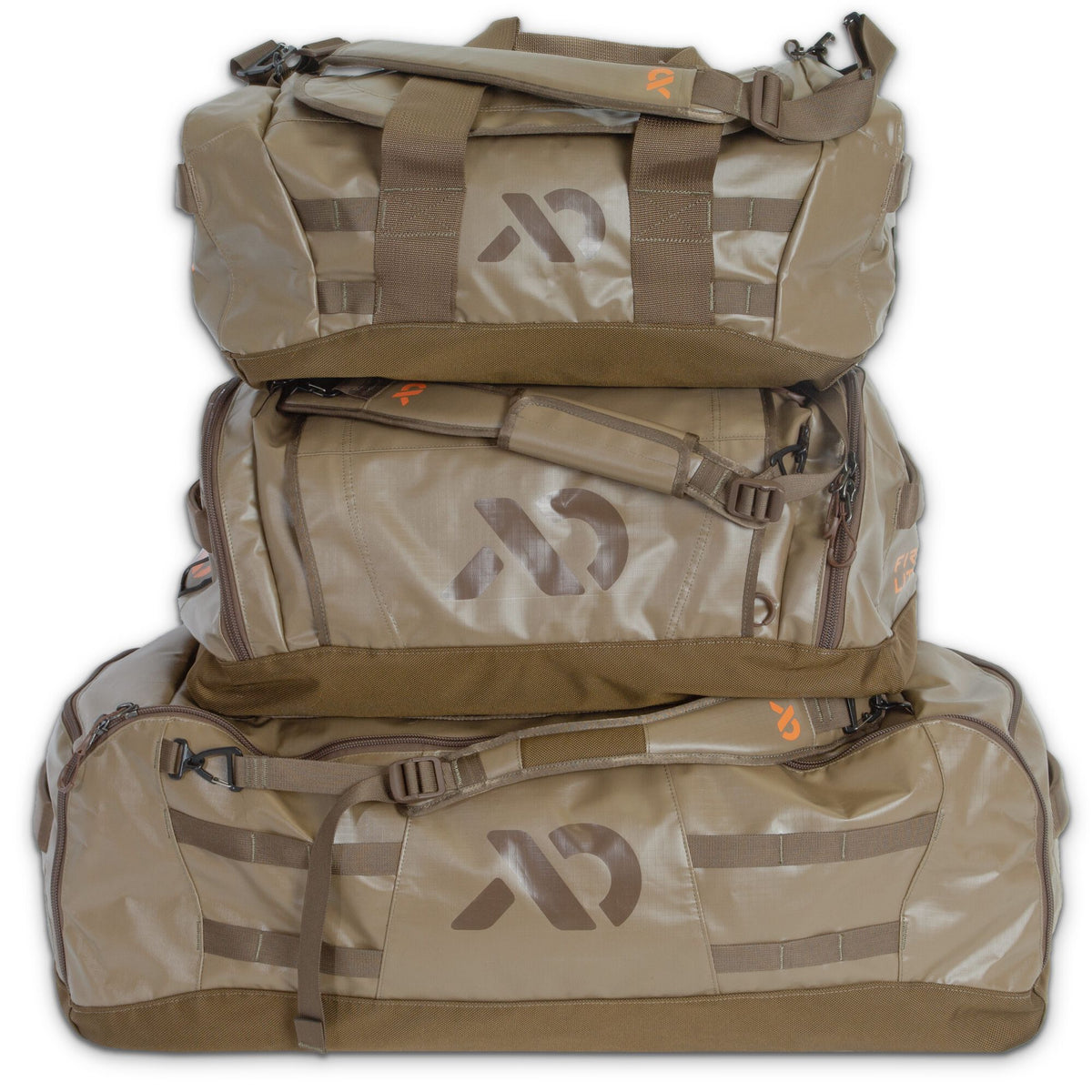 Three tan duffel bags stacked vertically, each with a prominent First Lite logo, padded top handles, and utility webbing.