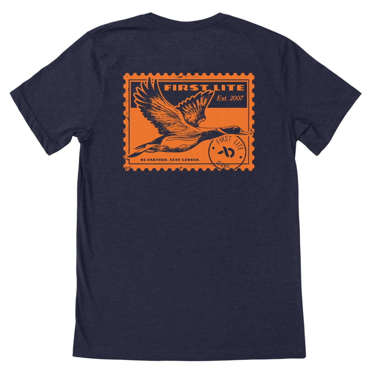 Navy heather T-shirt featuring an orange postage stamp of a wild duck flying , FIRST LITE branding and the text "FIRST LITE EST. 2007 GO FATHER. STAY LONGER.".