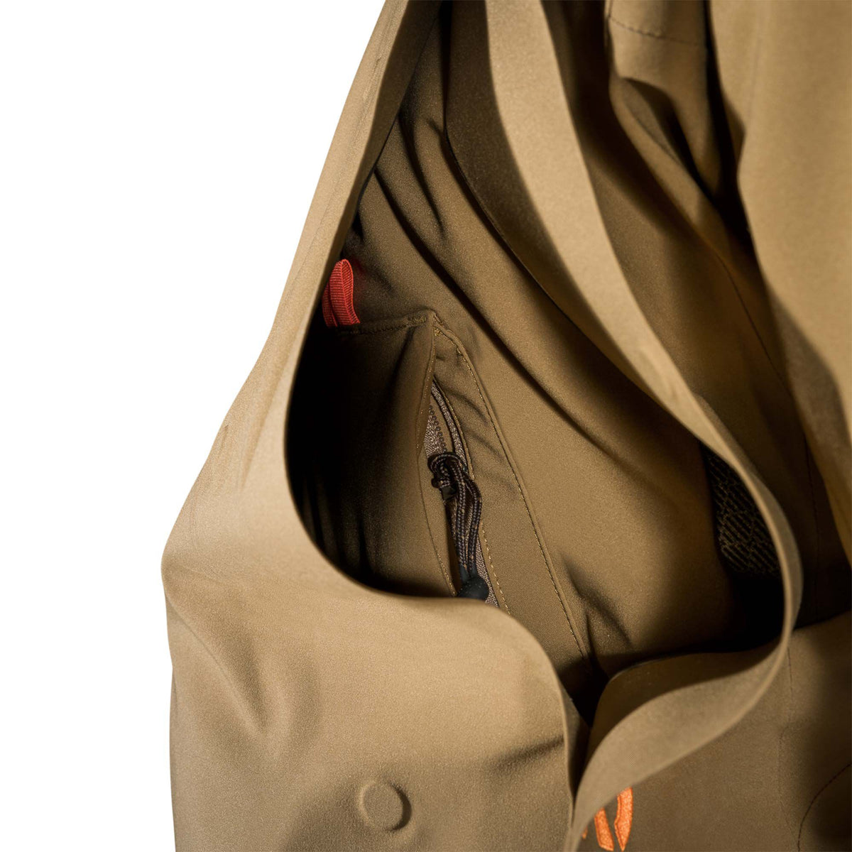 Khaki jacket's open interior pocket with a zipper, black cord pull, and orange fabric loop.