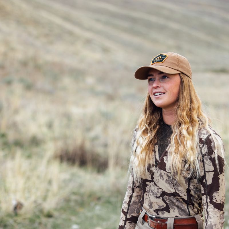 Tan baseball cap with a front patch logo.