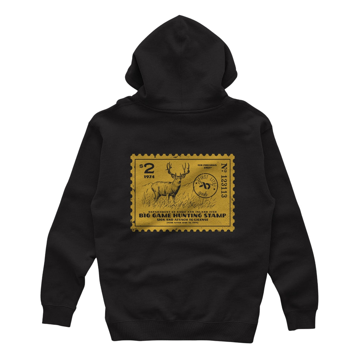 Black hoodie featuring a yellow postage stamp of a deer and mountains in the background, FIRST LITE branding and the text "DEPARTMENT OF GAME AND INLAND FISH BIG GAME HUNTING STAMP (VOID AFTER JUNE 30, 1975)".