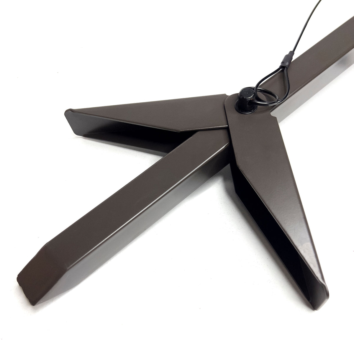 Dark bronze folding Christmas tree stand base with four legs and a central black pivot pin with a wire loop.