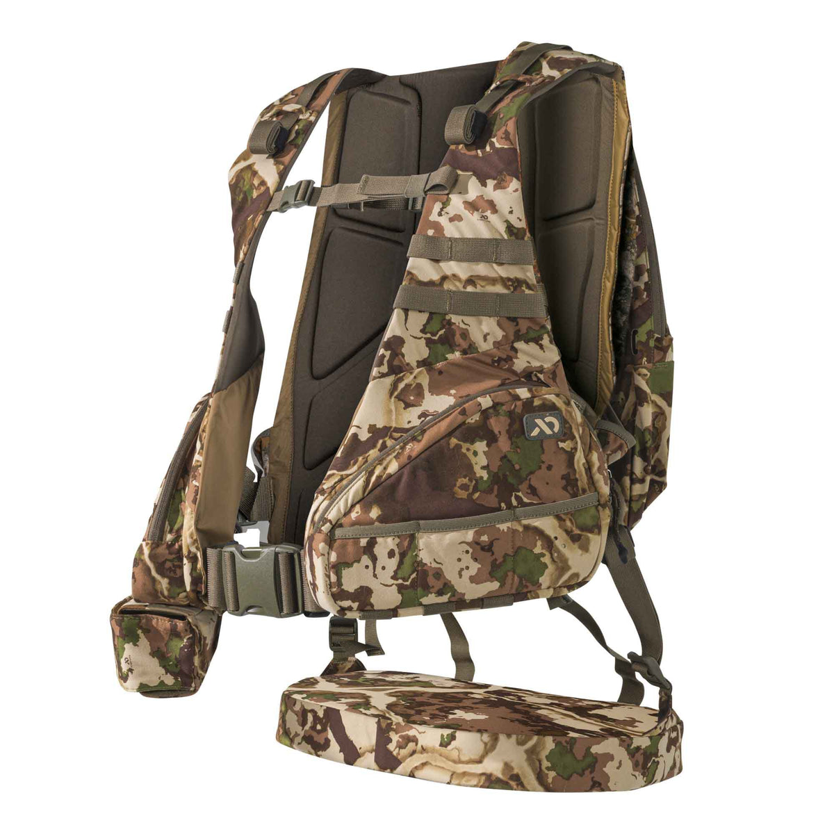 Camouflage hunting vest system with a large front pouch, padded back panel, and lower fold-down platform.