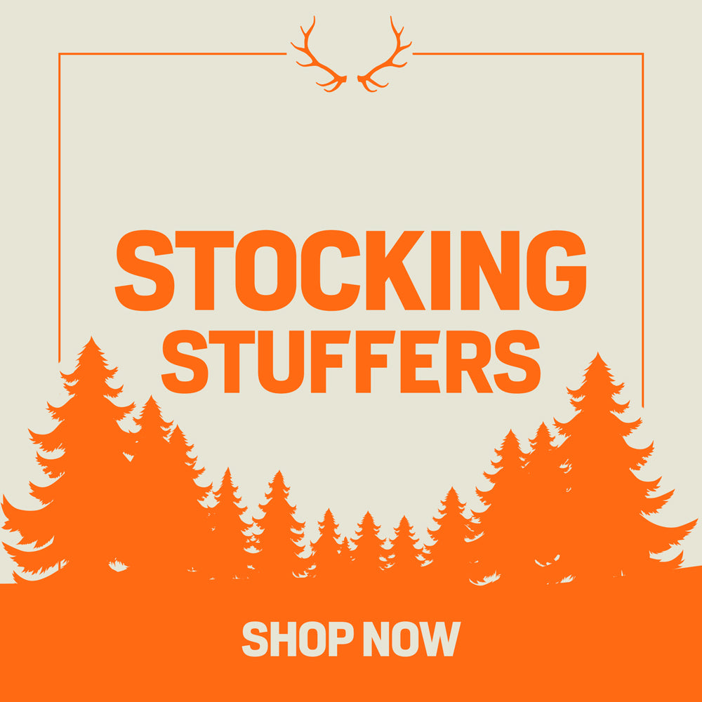 Orange "Stocking Stuffers" ad with antlers, pine trees, and "Shop Now" text on beige.