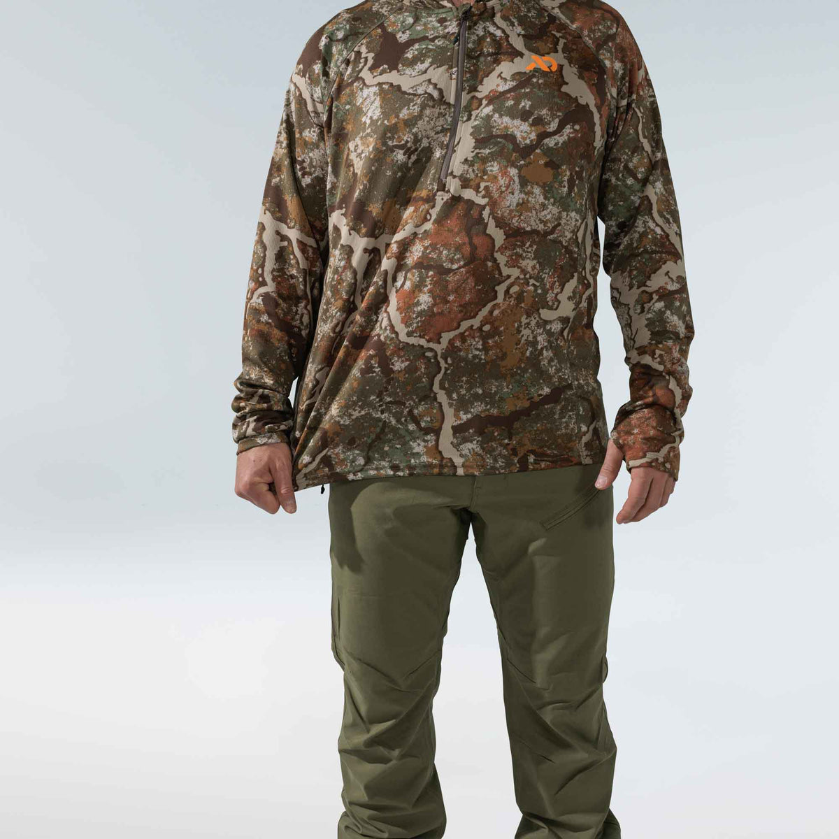 Men's camouflage long-sleeve 1/4 zip shirt featuring an orange chest logo and thumbholes.
