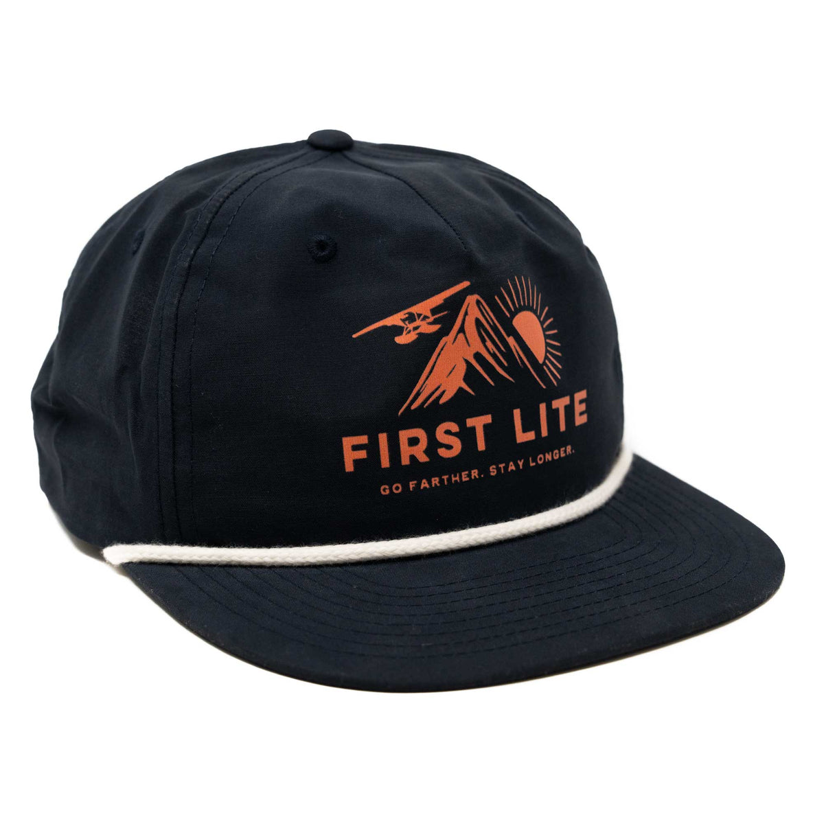 Navy cap with a white rope trim, featuring an orange graphic of mountains, a sun, a floatplane, and "FIRST LITE GO FARTHER. STAY LONGER."