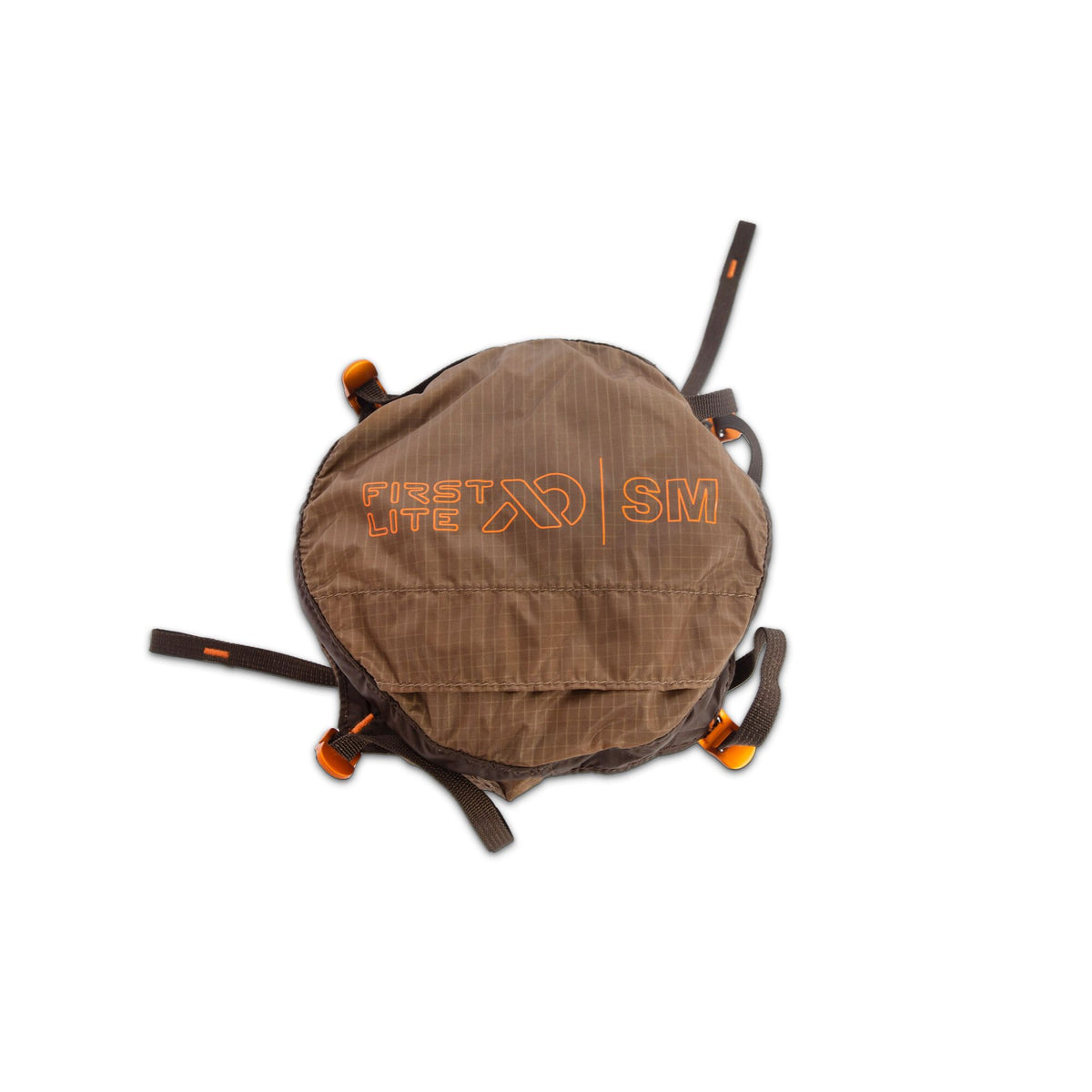 Brown ripstop First Lite SM compression sack with orange logo, text, and buckles.