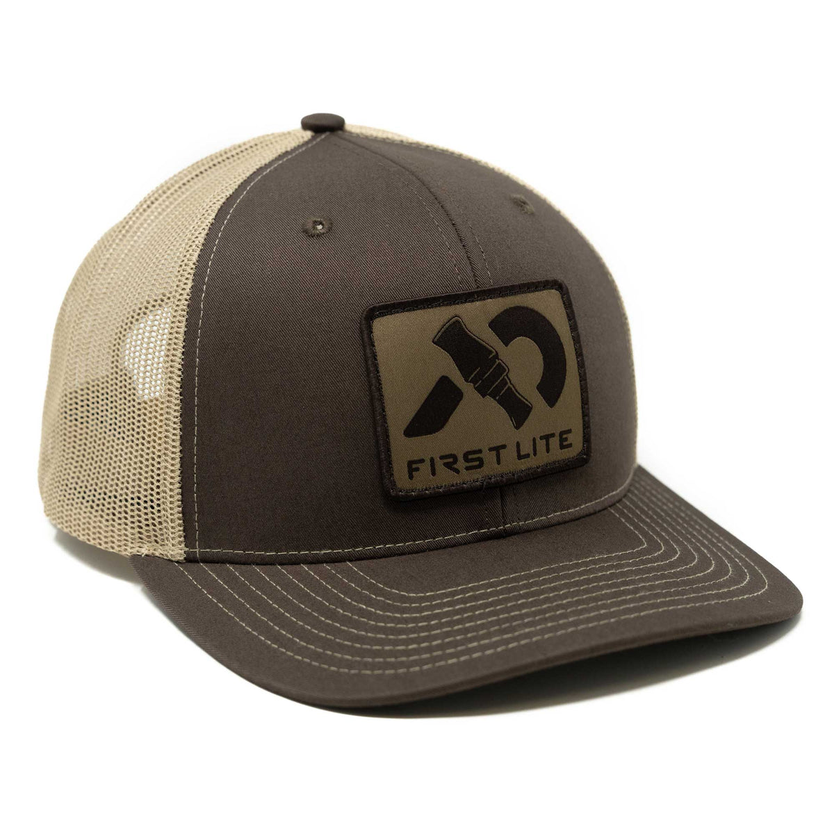 Dark brown and tan mesh trucker cap with an olive green patch featuring a duck call graphic and "FIRST LITE" text on the front.