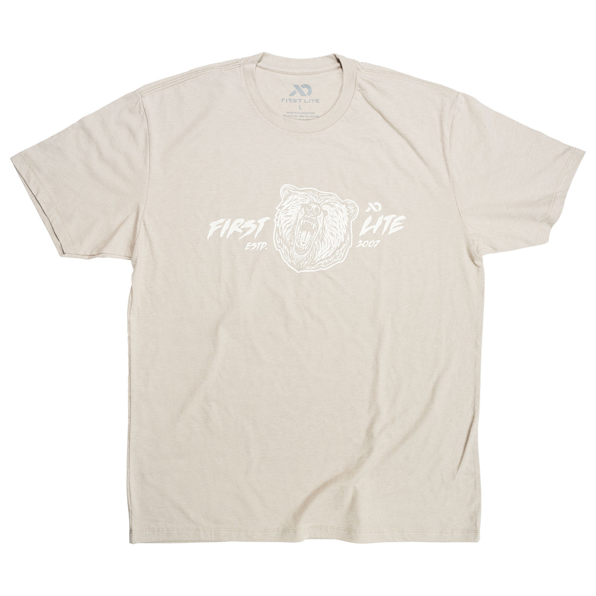 Beige t-shirt with a white graphic of a roaring bear head and "FIRST LITE ESTP. 2007" text.