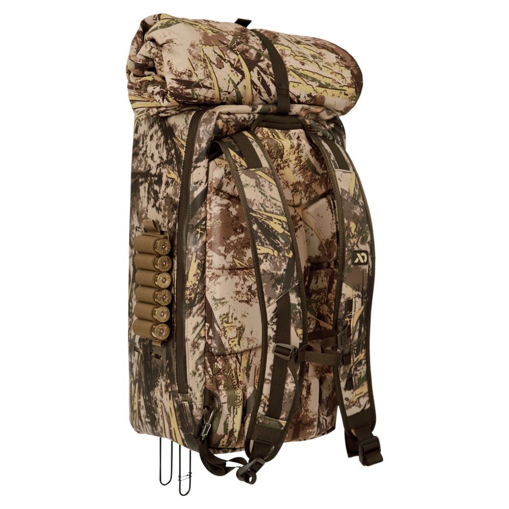 Camouflage rolltop hunting backpack with shotgun shell holder and integrated weapon carry hooks.