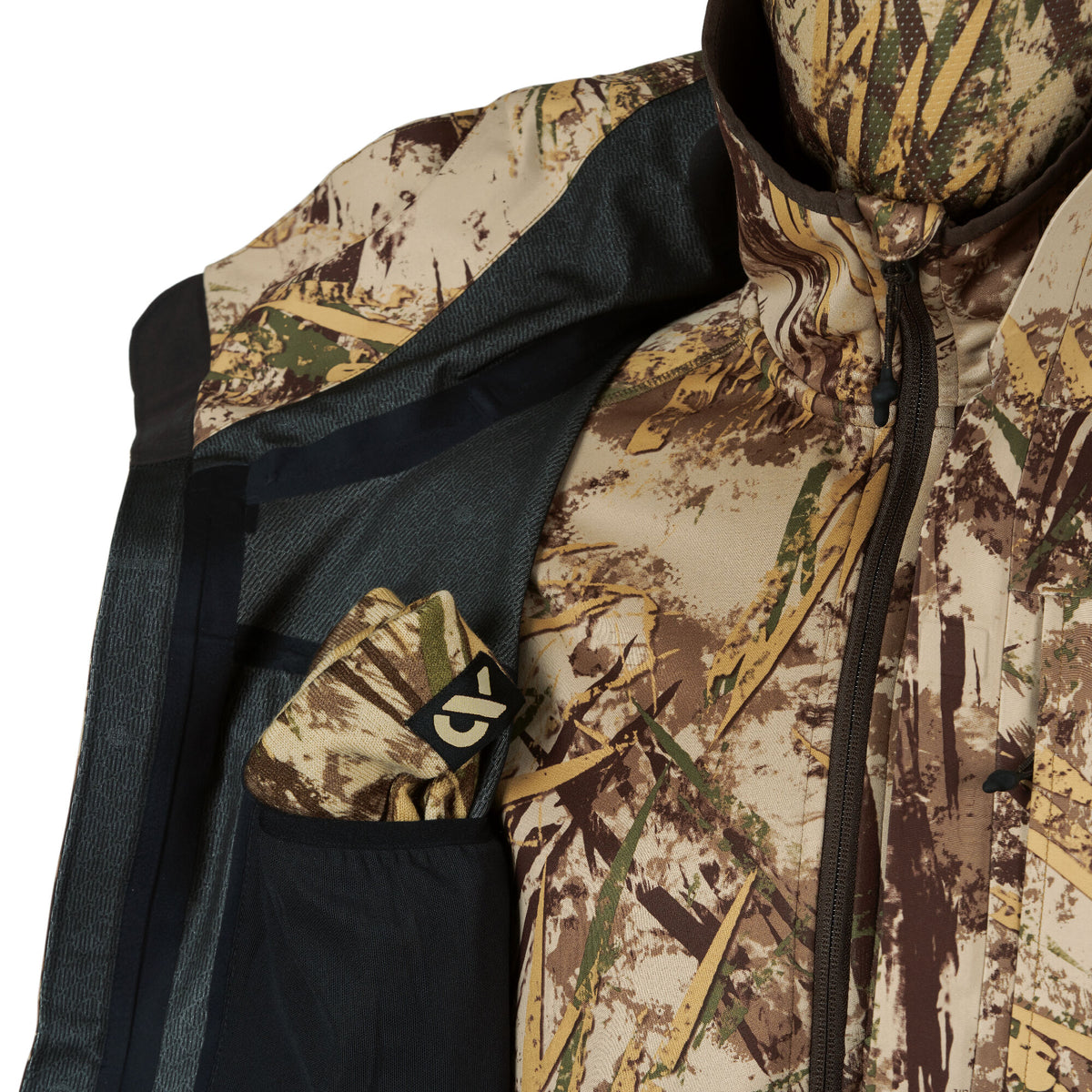 Camouflage jacket in a tan, brown, and green reed pattern, with an open side panel revealing dark mesh lining and a folded matching logoed accessory.