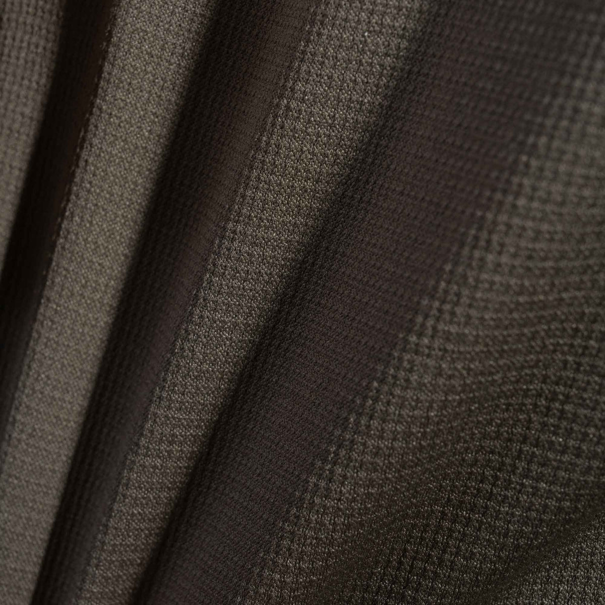Close-up of grid knit technical athletic fabric.