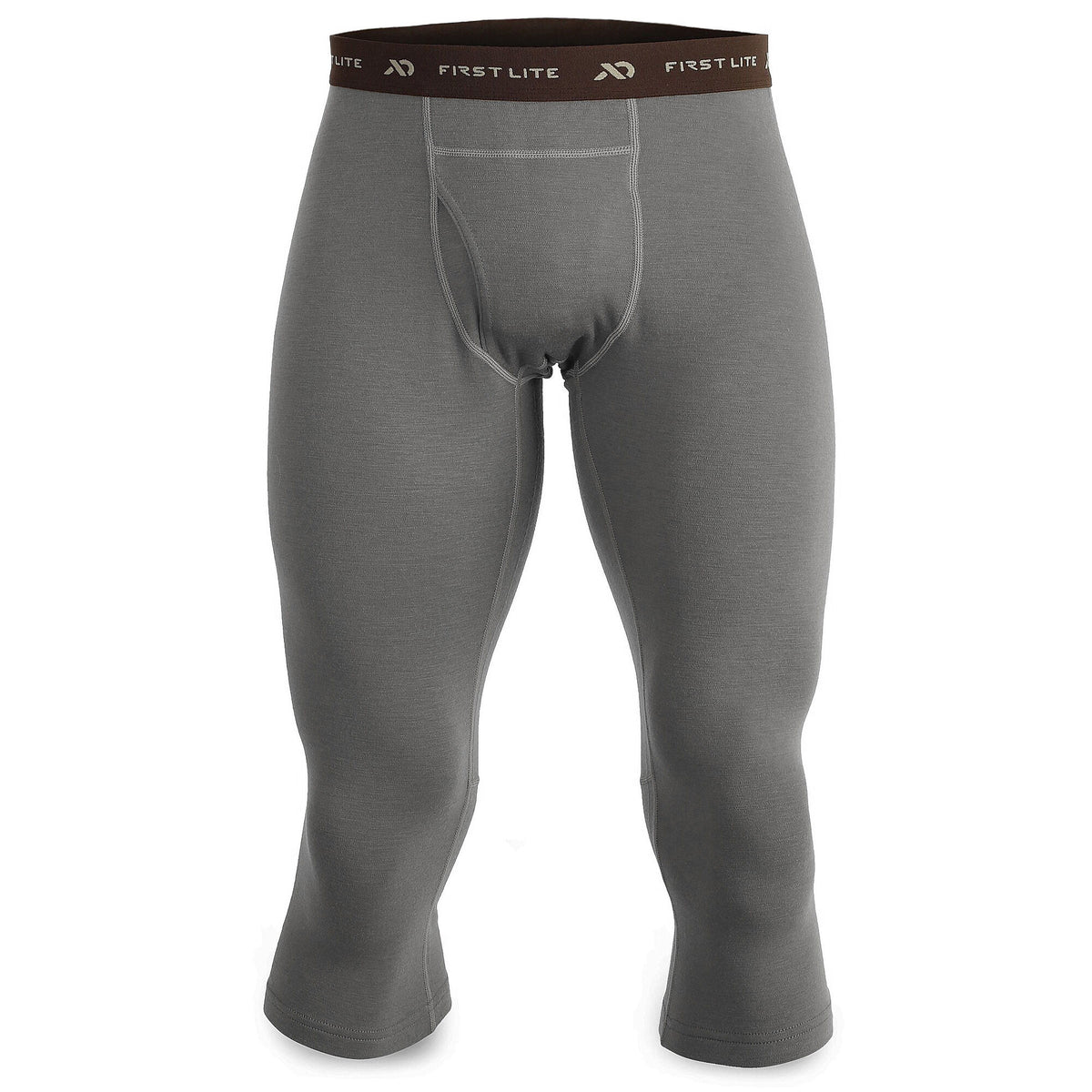 Grey 3/4 length base layer pants feature a brown elastic "FIRST LITE" waistband and a front fly opening.