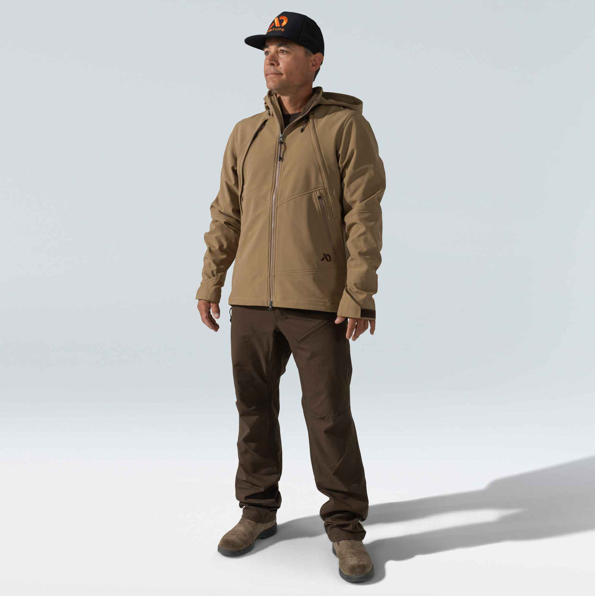 Tan hooded full-zip jacket with zippered chest and hand pockets, and a dark logo on the lower left.