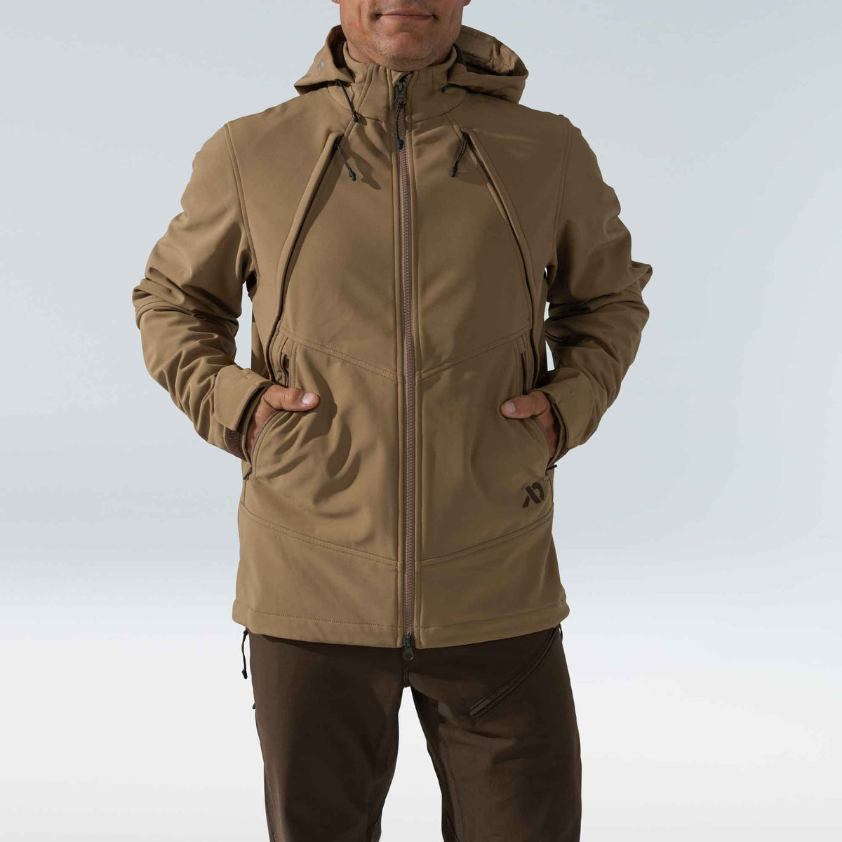 Men's tan hooded softshell jacket with a full zip, angled chest pockets with drawcords, and hand pockets.