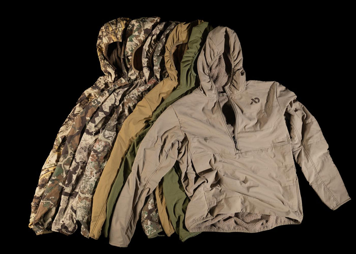 Insulated hooded pullovers in camo, tan, and olive green, with a quarter-zip closure.