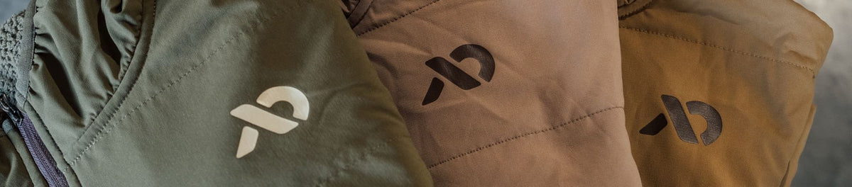Green, tan, and brown quilted jackets with distinctive logos, showing fabric texture.