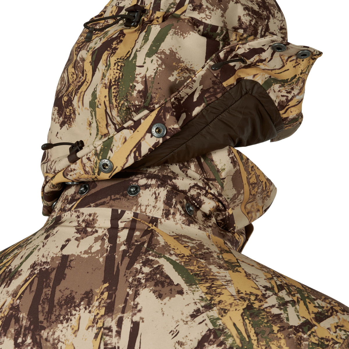 Back of a brown, tan, green, and cream camouflage jacket with a hooded neck, showing dark brown trim, drawstrings with toggles, and snap closures.