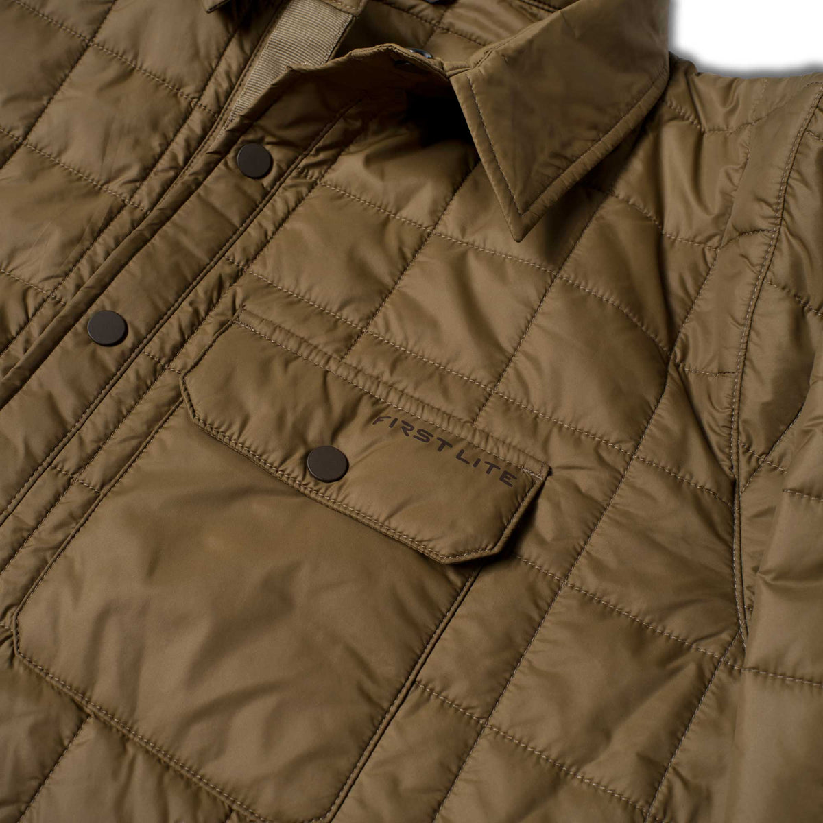 Olive green diamond quilted jacket with a collar, snap buttons, and a flap chest pocket featuring the "FIRST LITE" logo.
