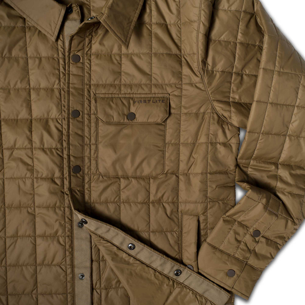 Coyote brown quilted shirt jacket with a collar, snap-front closure, and a chest pocket displaying the 'FIRST LITE' logo.