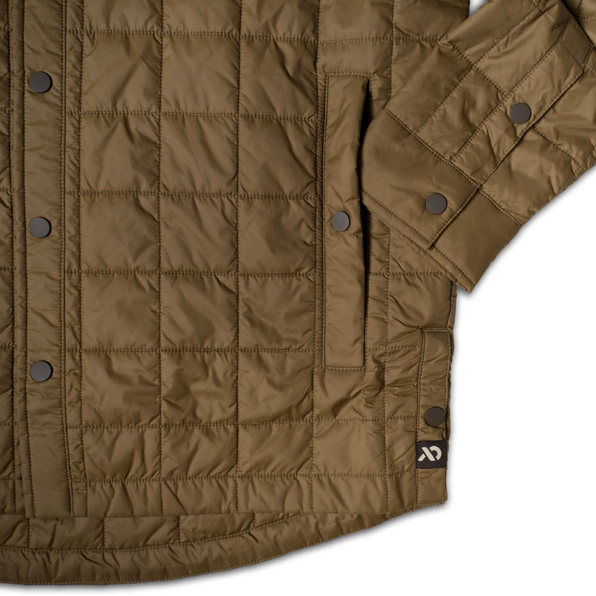 Olive green quilted jacket with square stitching, dark snap buttons, and a black logo tag with a white symbol.