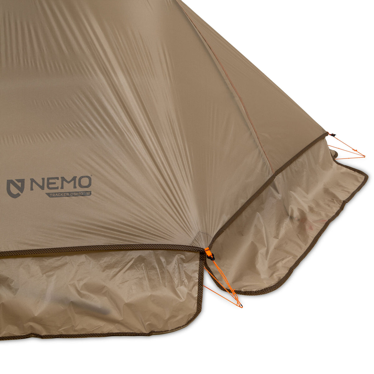Close-up of a tan NEMO TRACKER OSMO 1P tent fly showing its ripstop fabric, brown trim, and orange guide lines.