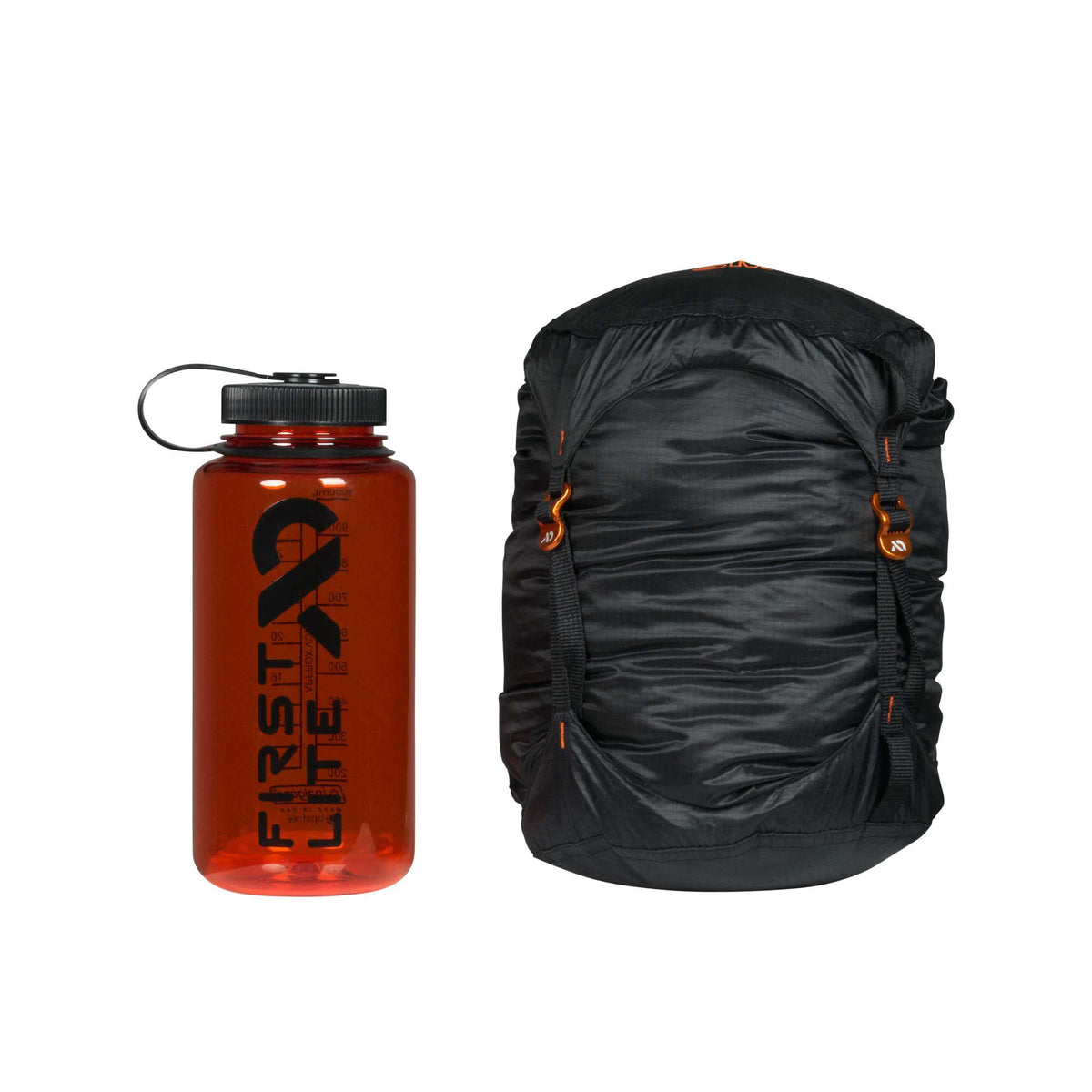 A translucent orange water bottle with a black cap and "FIRSTLITE" logo is next to a black compression sack with orange buckles.