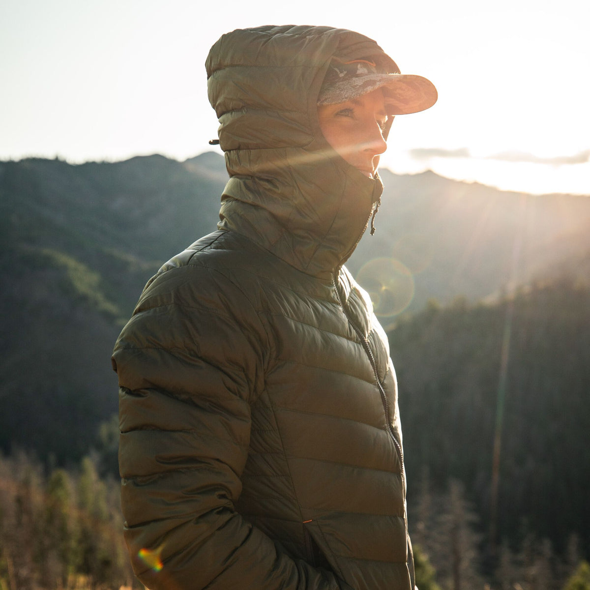 Olive green hooded puffer jacket with diagonal chest baffles and a full-zip front.