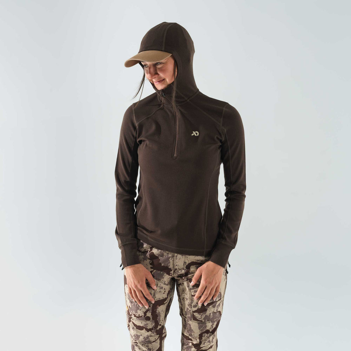 Dark brown quarter-zip hoodie with a tan-brimmed hood and chest logo.